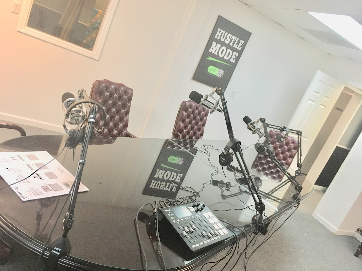 Podcast and recording setup with microphones, headphones, and a mixer at The Complexx ATL